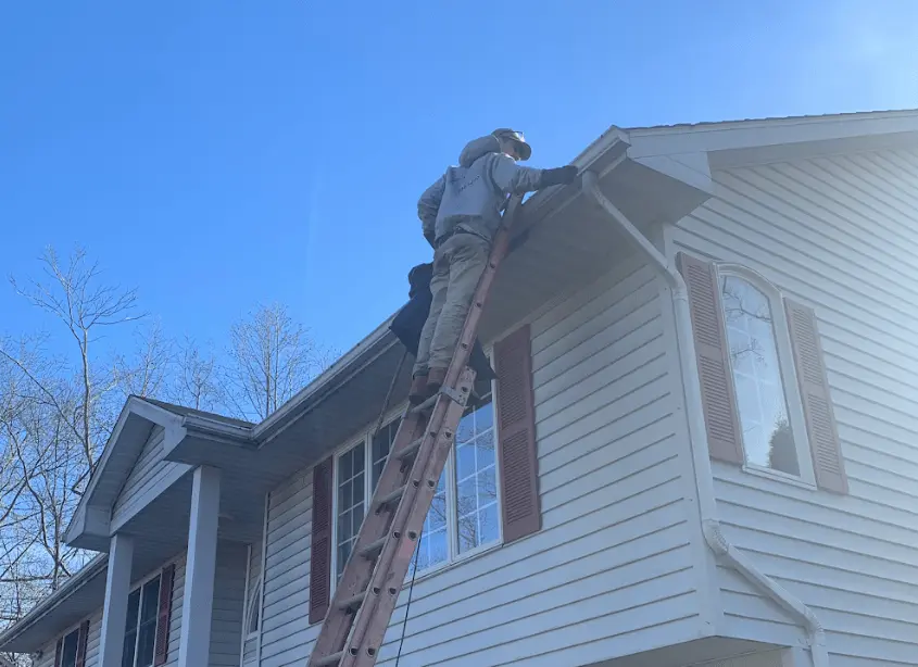 Gutter cleaning and maintenance being performed by North Royalton Power Washing in North Royalton