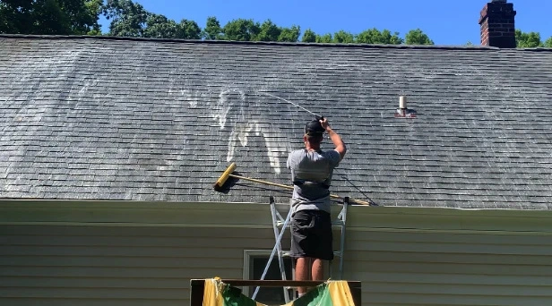 Before and after results of roof washing by North Royalton Power Washing in North Royalton